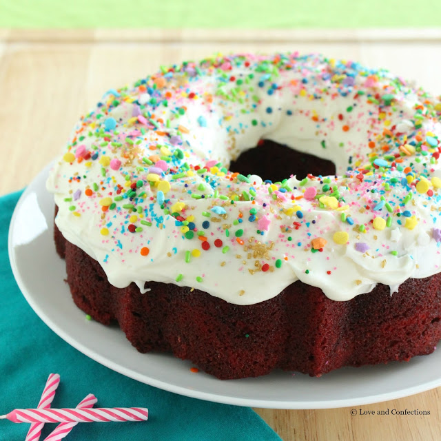Red Velvet Sprinkle Explosion Bundt Cake #BundtBakers from LoveandConfections.com