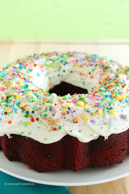 Red Velvet Sprinkle Explosion Bundt Cake #BundtBakers from LoveandConfections.com