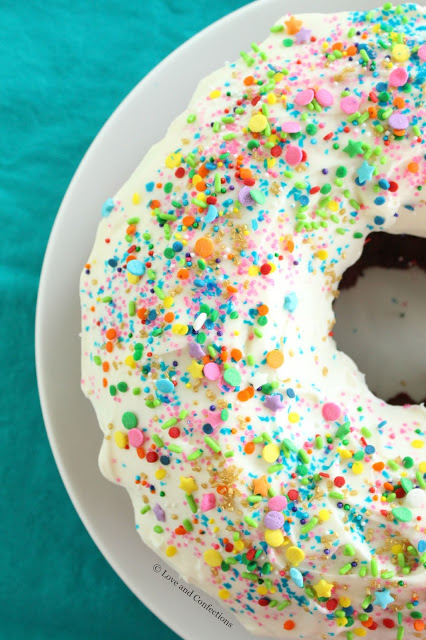 Red Velvet Sprinkle Explosion Bundt Cake #BundtBakers from LoveandConfections.com