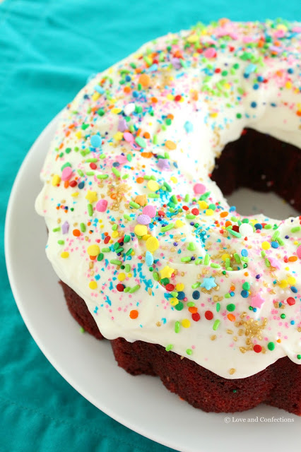 Red Velvet Sprinkle Explosion Bundt Cake #BundtBakers from LoveandConfections.com