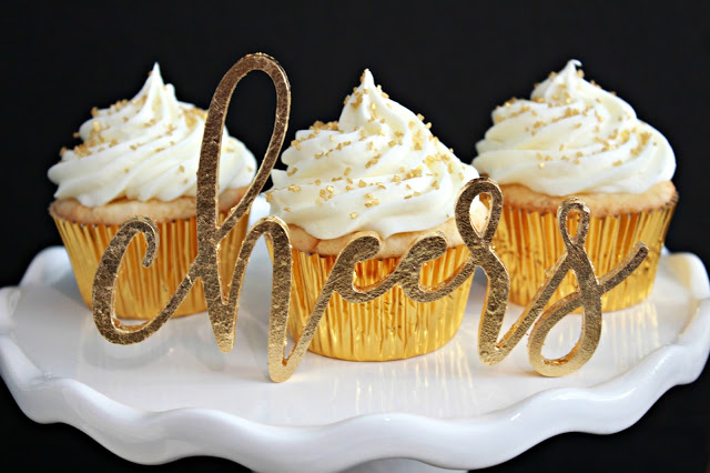 Sparkler Vanilla Bean Cupcakes with White Chocolate Frosting from LoveandConfections.com