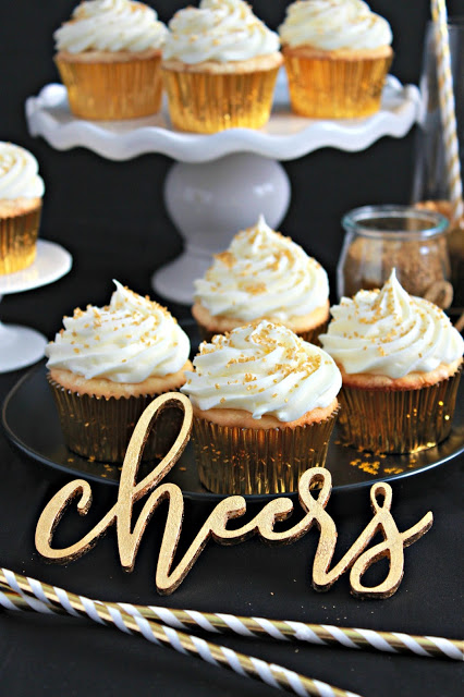 Sparkler Vanilla Bean Cupcakes with White Chocolate Frosting from LoveandConfections.com