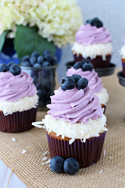 Coconut Cupcakes with Coconut and Blueberry Frosting from LoveandConfections.com #BrunchWeek