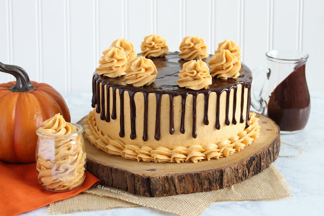 Chocolate pumpkin layer cake with spiced pumpkin frosting and chocolate ganache drip