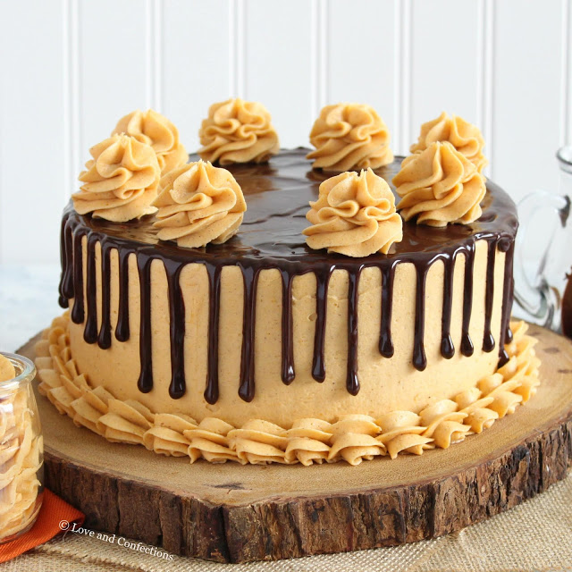 Chocolate pumpkin layer cake with spiced pumpkin frosting and chocolate ganache drip