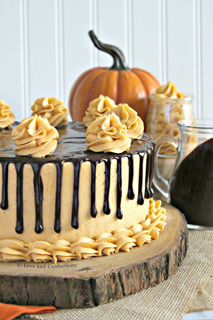 Chocolate pumpkin layer cake with spiced pumpkin frosting and chocolate ganache drip