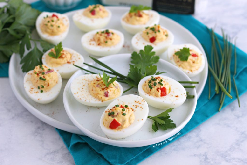 I also make deviled eggs for my own family's special occasions and holidays. Easter is coming up, so you can be sure that deviled eggs are on the menu. My sister and I have a running joke: if they're scrambled, I can only eat two eggs, if they're deviled, I can eat forty! When it comes to both deviled eggs and pimento cheese, you can never have enough at a party. My White Cheddar Pimento Cheese Spread from Brunchweek was the first time I created homemade pimento cheese. I used two different Cabot cheeses for the spread, and both are equally delicious. It is a recipe definitely worth keeping on hand. Farmhouse Cheddar in this recipe is from Cabot Creamery Co-operative. Cabot is a co-operative owned by families throughout the Northeast and is the world’s first dairy co-operative to achieve B corp certification. 100% of profits go back to the farmers. All of Cabot's cheddars are naturally aged, gluten-free and 100% lactose-free. 2019 is a big year for Cabot, as they celebrate their 100th year as a co-operative. I bet they would love these Pimento Cheese Deviled Eggs at their celebration! I regularly keep Cabot's line of cheddar in my refrigerator. Cabot's Legacy Collection is always a favorite, as well as their Seriously Sharp and Vermont Sharp bars. My family loves their flavored cheddar too! Little L&C eats the Cracker Cuts for her after-school snack and we freshly grate the bars for our weekly taco night. Cabot has a cheese for every occasion!
