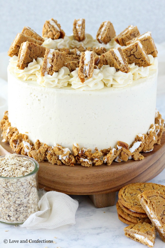 Oatmeal Cream Pie Layer Cake - oatmeal brown sugar layer cake, marshmallow frosting filling, and vanilla bean buttercream with oatmeal cream pie garnish