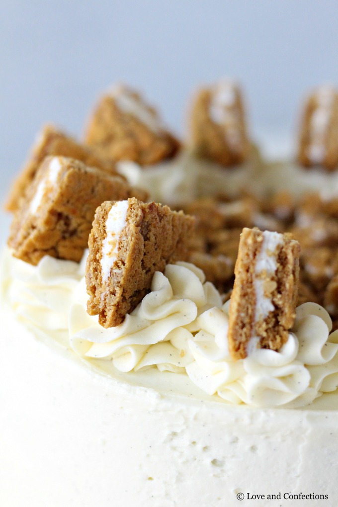 Oatmeal Cream Pie Layer Cake - oatmeal brown sugar layer cake, marshmallow frosting filling, and vanilla bean buttercream with oatmeal cream pie garnish