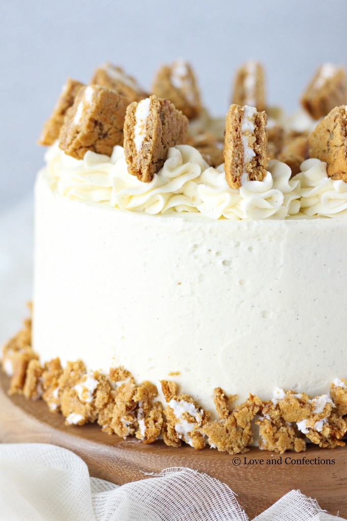 Oatmeal Cream Pie Layer Cake - oatmeal brown sugar layer cake, marshmallow frosting filling, and vanilla bean buttercream with oatmeal cream pie garnish